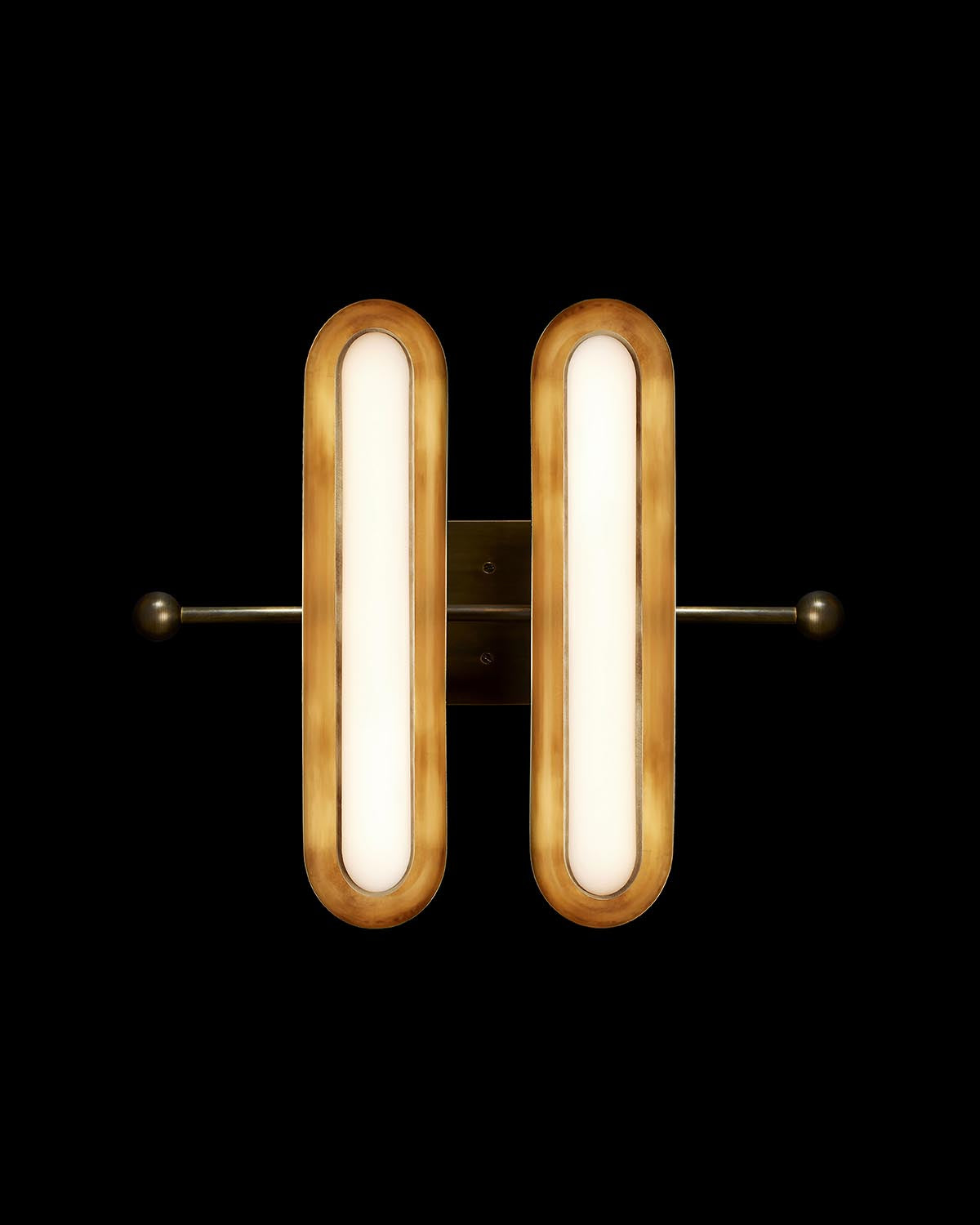 Front view of a double elongated oval wall light fixture in warm bronze finish against black background