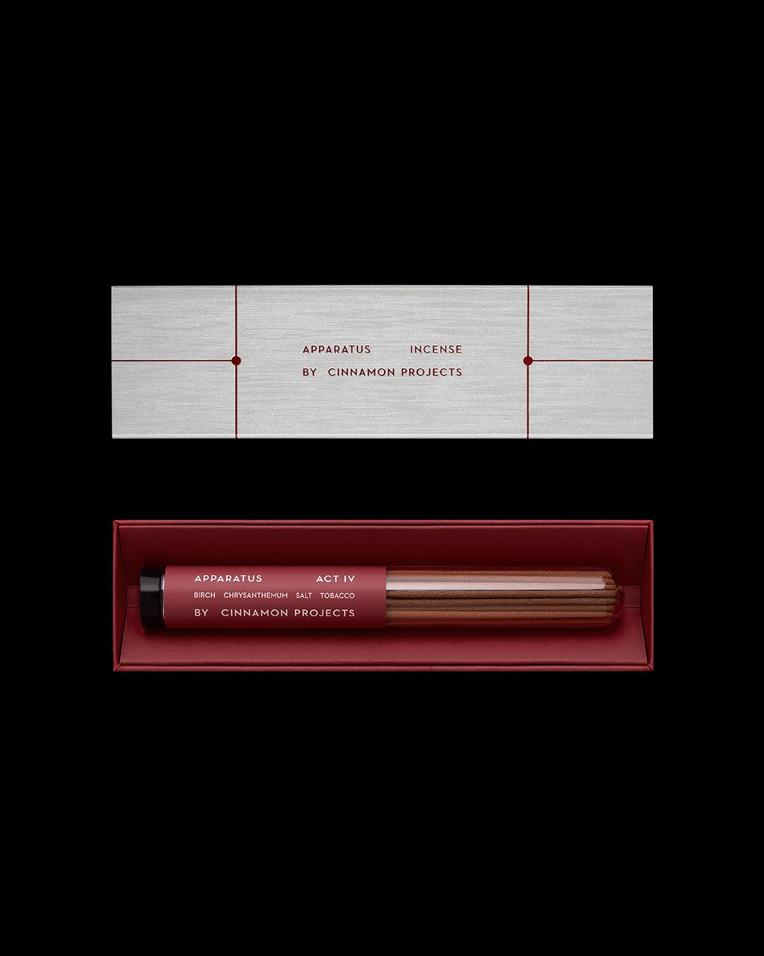 Rectangular incense packaging with minimal red and gray design and incense sticks inside a red tray on black background