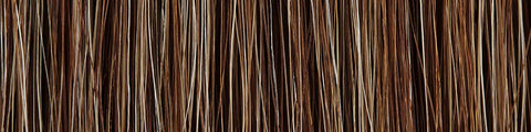 Close-up of natural brown and blonde hair strands with varied thickness and texture against a neutral background