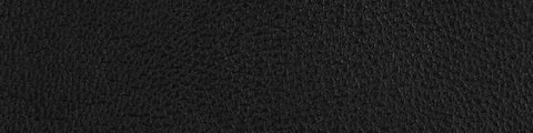 Close-up of black textured leather surface with fine grain pattern and subtle natural creases on a dark background