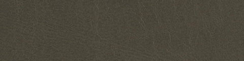 Close-up of muted clay-colored leather with subtle grain texture and gentle natural creasing across the surface