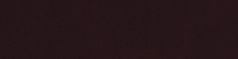 Close-up of deep garnet leather surface showing fine grain texture and subtle natural creases throughout