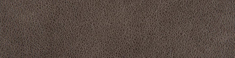 Close-up of textured brown leather surface with natural grain pattern and subtle variations in color and shading