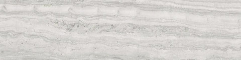 Close-up of light marble surface with beige and white irregular veins and natural textured patterns