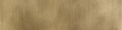 Close up of aged brass material swatch.