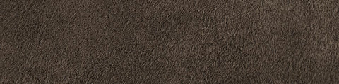 Close-up view of soft ash-gray suede displaying a finely textured surface with subtle depth and natural variations in tone
