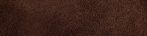 Close-up of cedar-colored suede fabric with a soft, finely textured surface and natural tonal variations throughout
