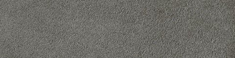 Close-up view of soft, cloud-gray suede with a finely textured surface and subtle tonal variations across the fabric