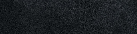 Close-up of deep midnight-blue suede with a soft, finely textured surface and natural tonal variations throughout