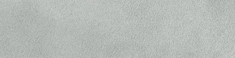 Close-up of a smooth light gray concrete surface with subtle texture and faint natural variations
