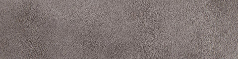 Close-up of a textured grey concrete surface with subtle speckles and fine granular details