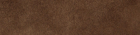 Close-up of a textured brown surface with natural variations and a slightly rough appearance against a neutral background