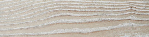 Close-up of light wood grain texture with natural knots and linear patterns in a neutral beige tone