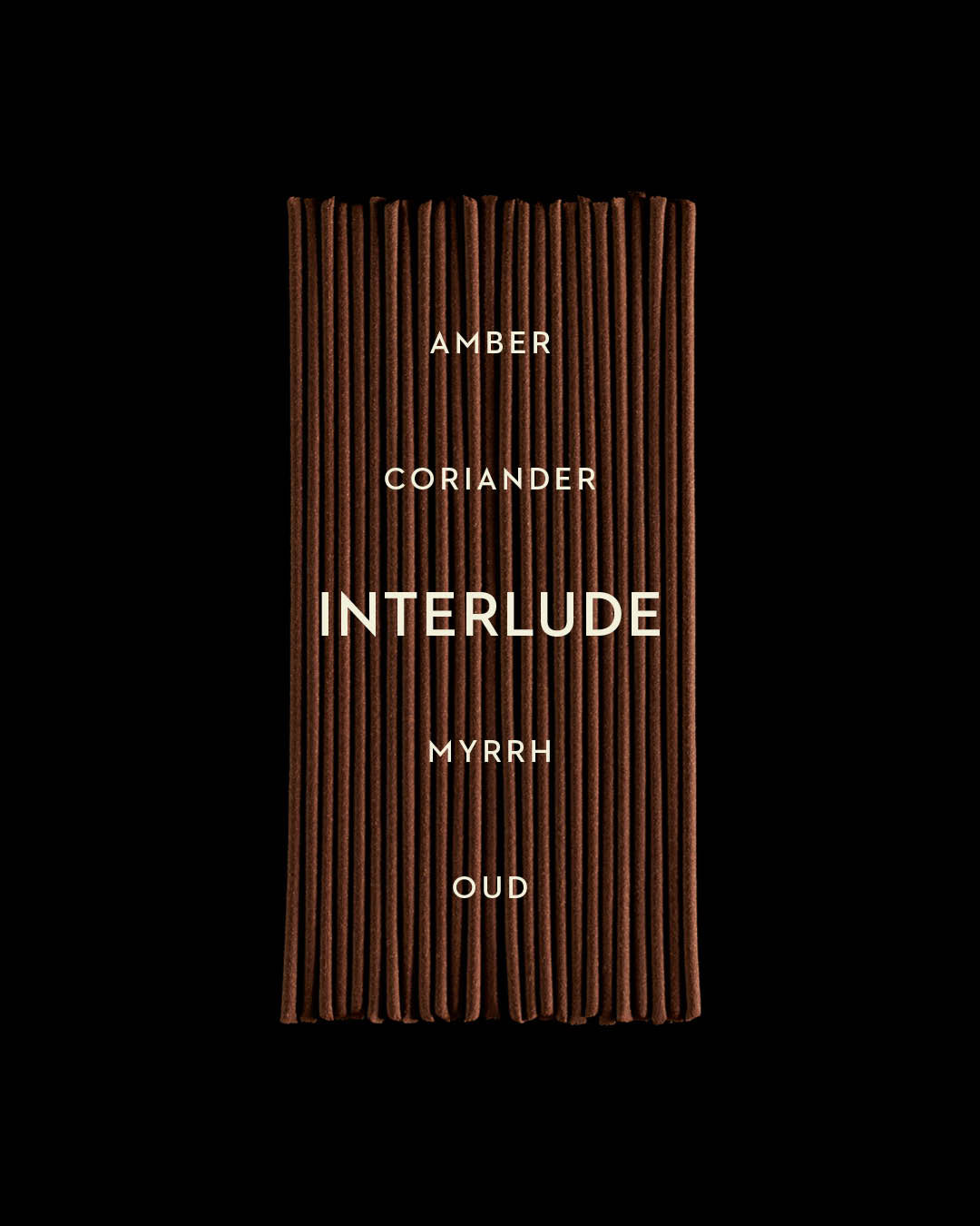 Close-up of neatly arranged brown incense sticks with white text listing amber, coriander, myrrh, and oud on black background