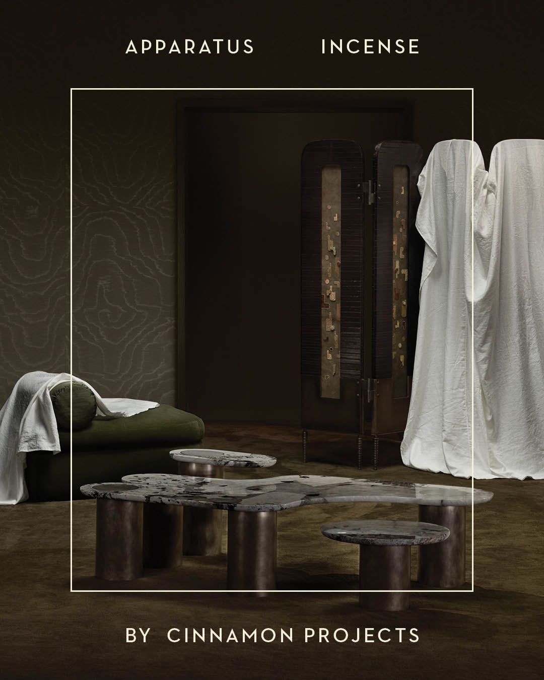 Abstract sculptural coffee table with dark cylindrical legs and irregular stone top in a dimly lit room with fabric drapes and screen divider