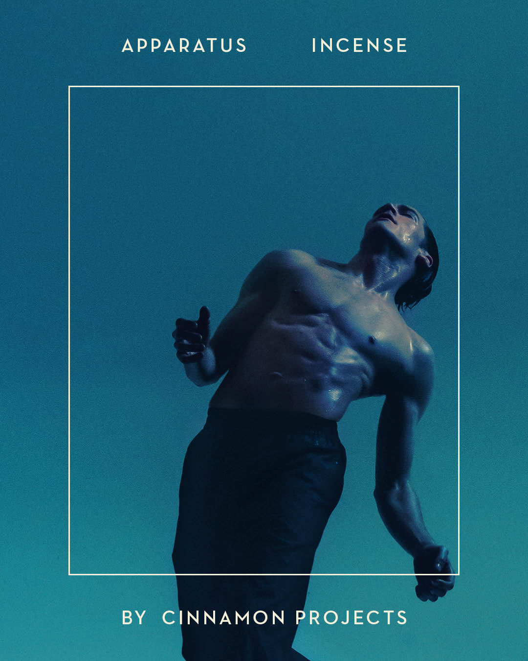 Artistic low-angle shot of a shirtless male figure with dramatic lighting against a deep blue background