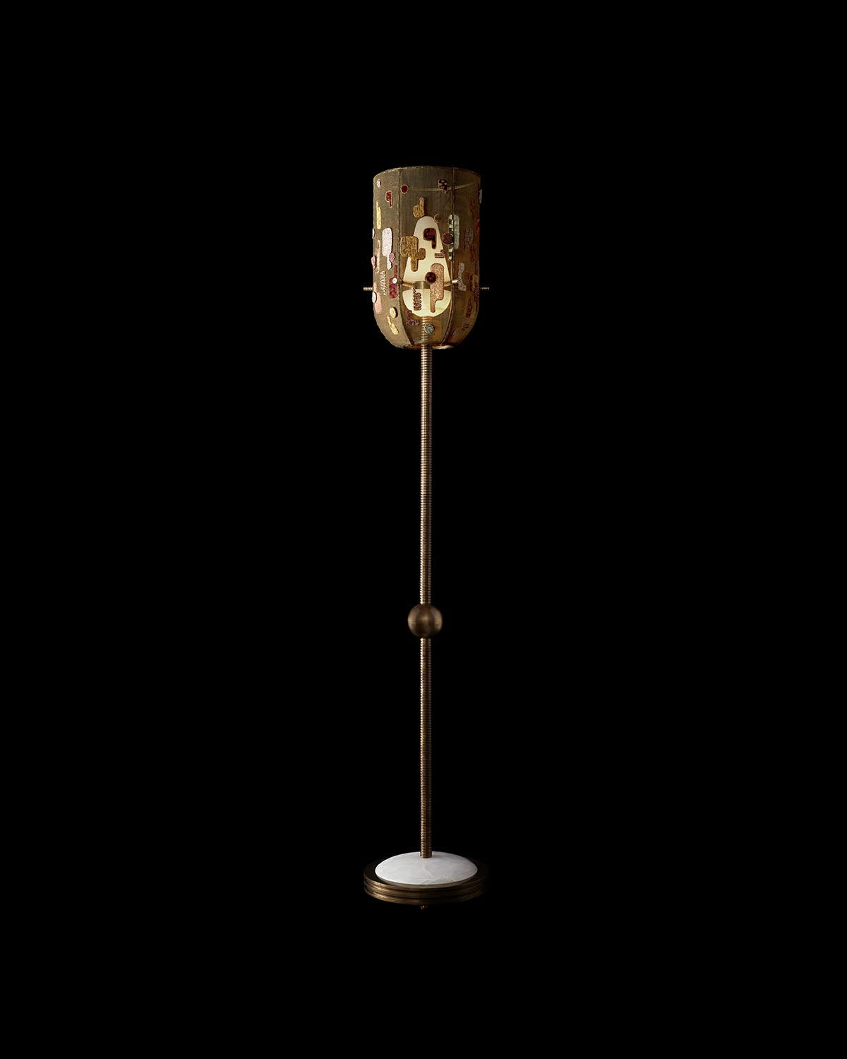 Hand-embroidered floor lamp with cylindrical shade featuring abstract patterns on a thin metal stand and round base