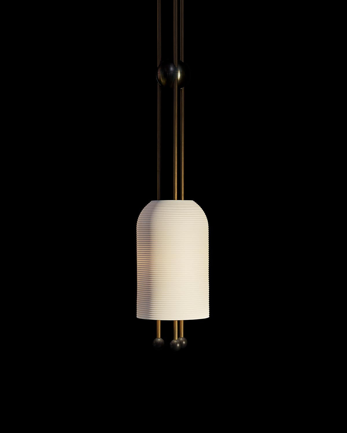 Single pendant light fixture with ribbed cylindrical white shade suspended by thin vertical rods against black background
