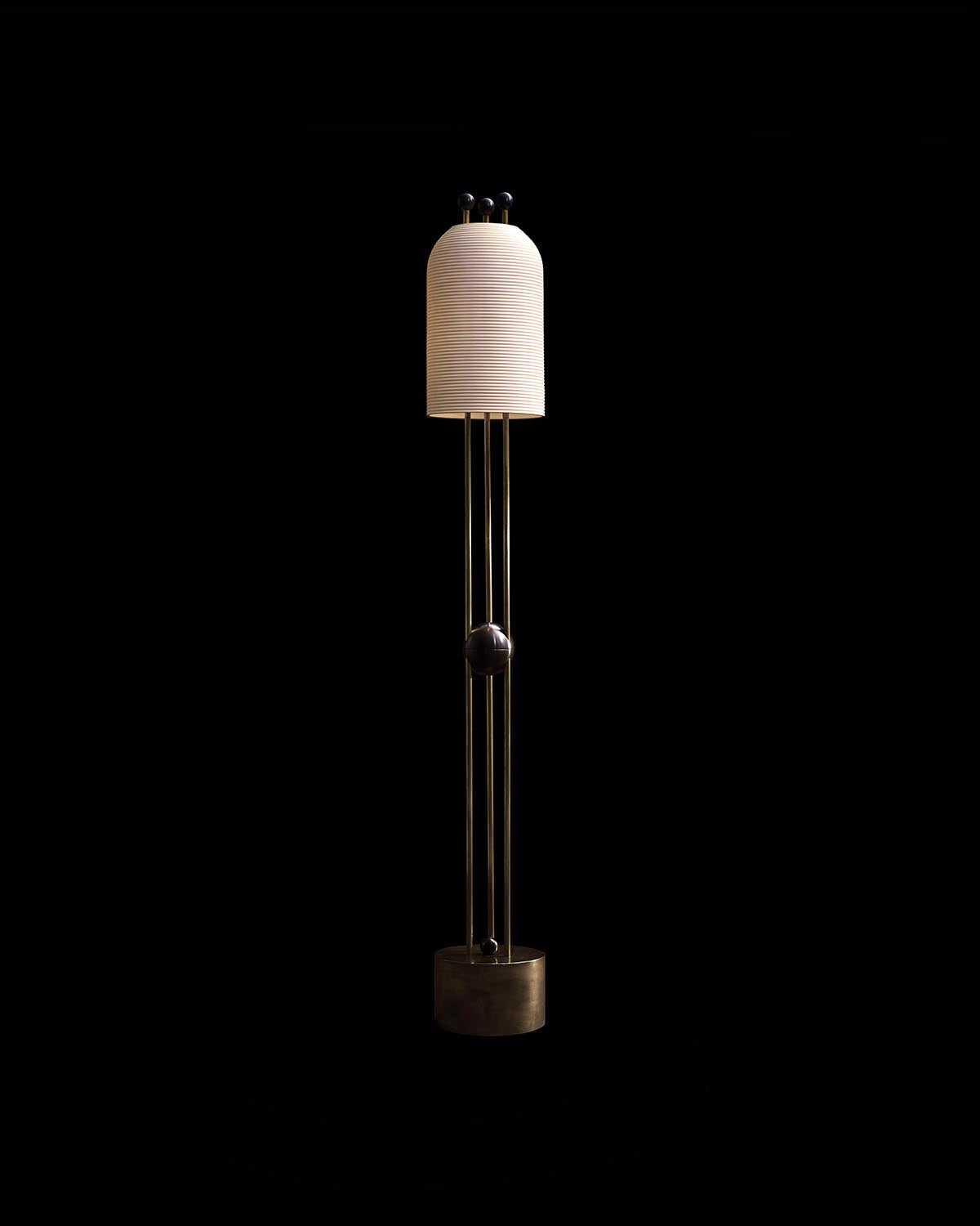 Tall floor lamp with a ribbed cylindrical white shade and slim metal frame on a round base against black background