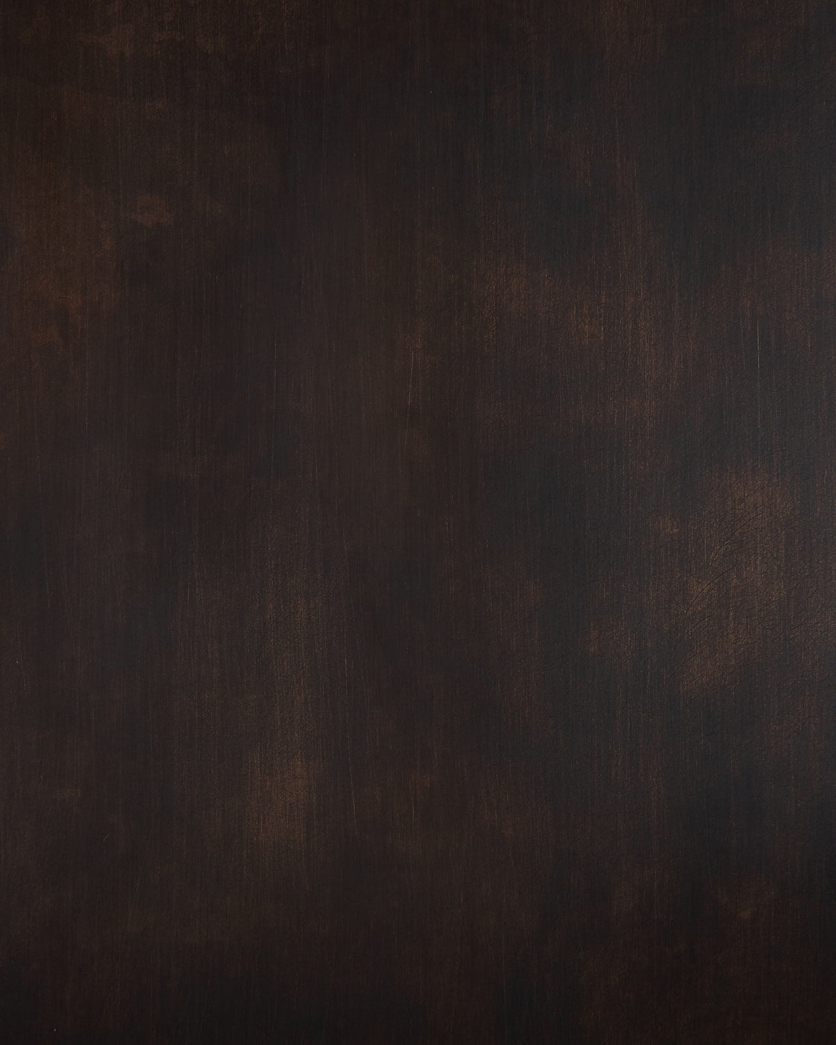 Dark brown textured wooden surface with subtle variations in tone and grain patterns throughout
