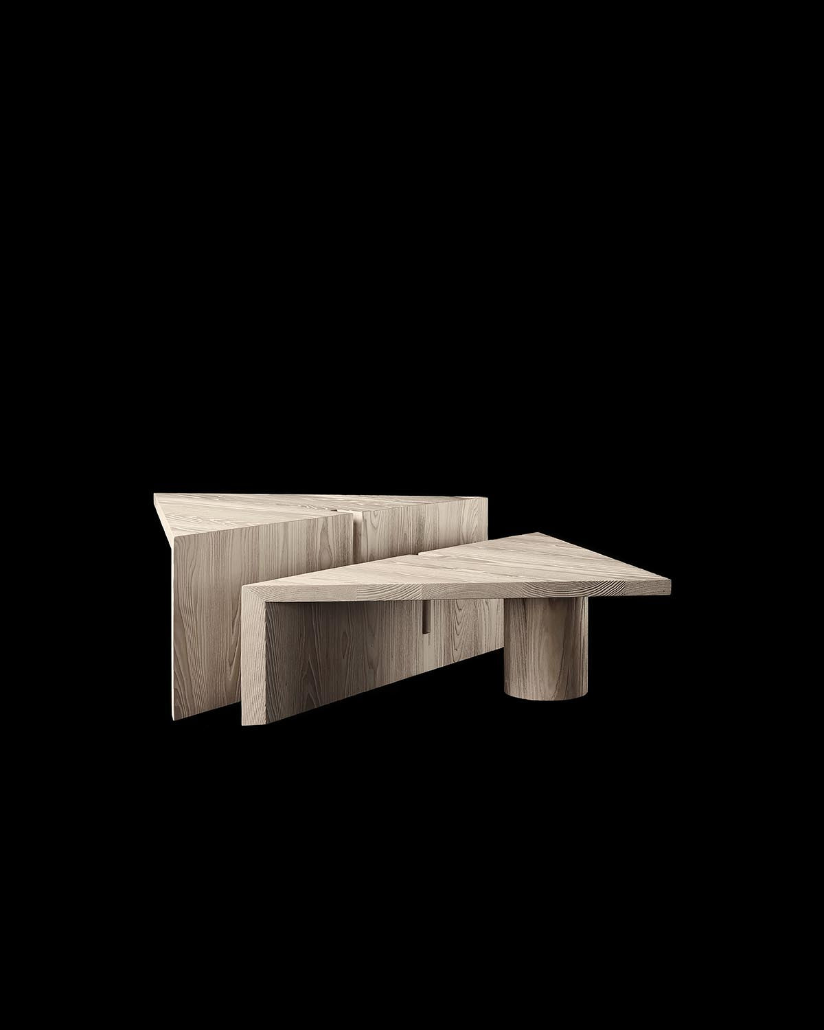 Pair of triangular wood coffee tables with varied base shapes displayed against a black background