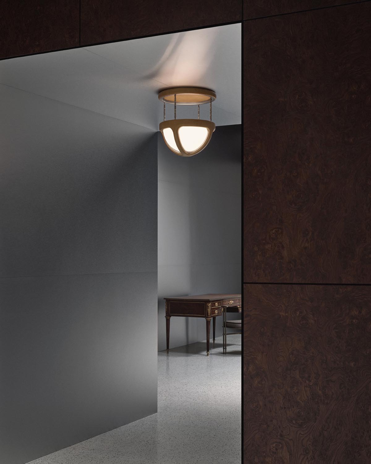 Modern ceiling light fixture with rounded frosted glass panels suspended by metal rods in minimalist interior space