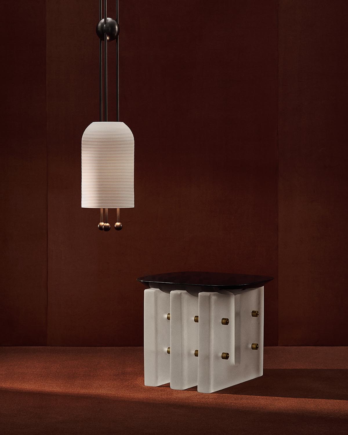 Modern side table with layered white panels and dark round top, set against a deep brown textured backdrop