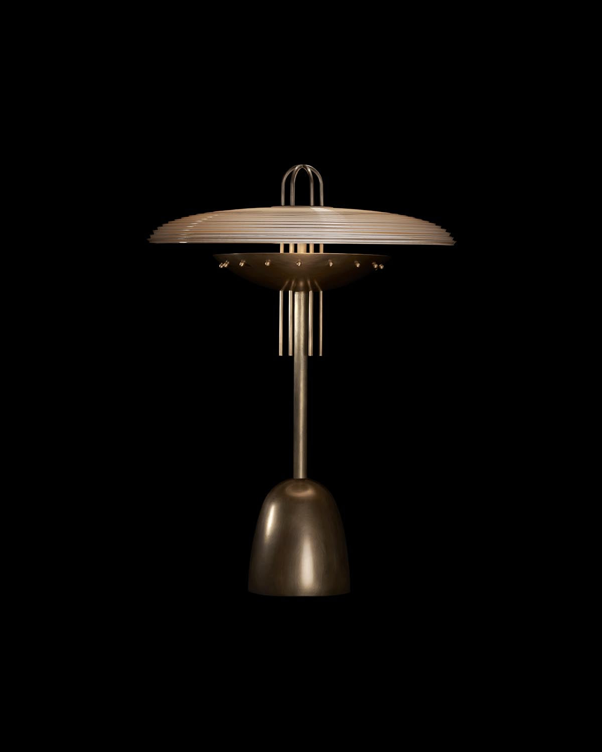 Side view of metallic table lamp with domed base, vertical rod, and wide ribbed circular shade against black background