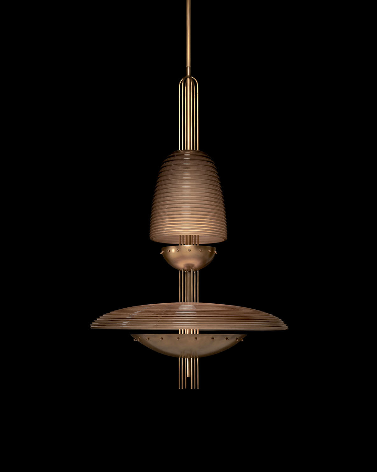 Suspended bronze pendant light with layered ribbed shades and vertical metal rods against black background
