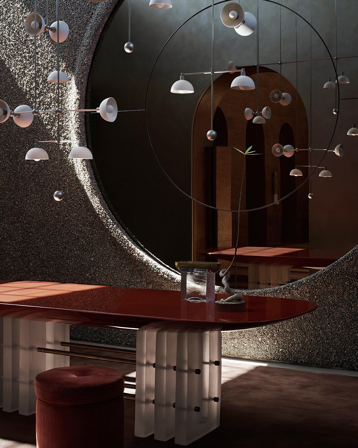 Dining space with glossy red table, textured curved wall, circular mirror, and modern hanging light fixtures in muted tones