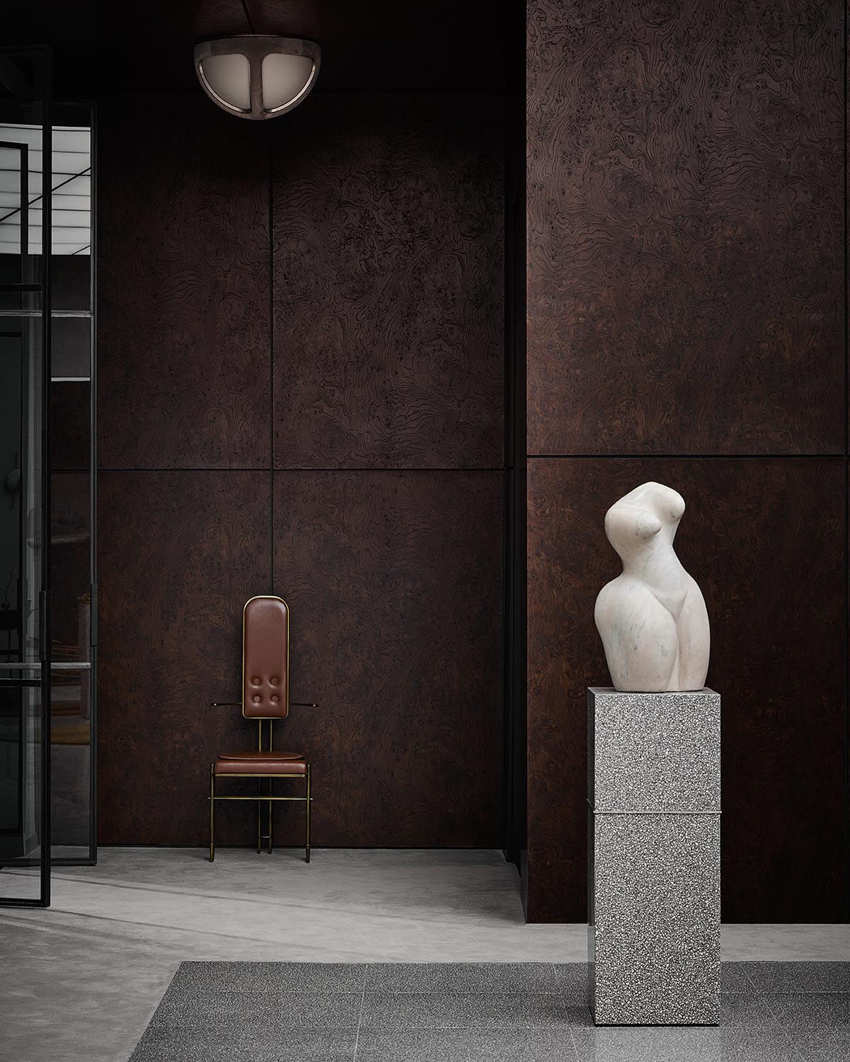 Abstract white marble sculpture on a textured gray pedestal against dark brown paneled walls with a leather chair nearby