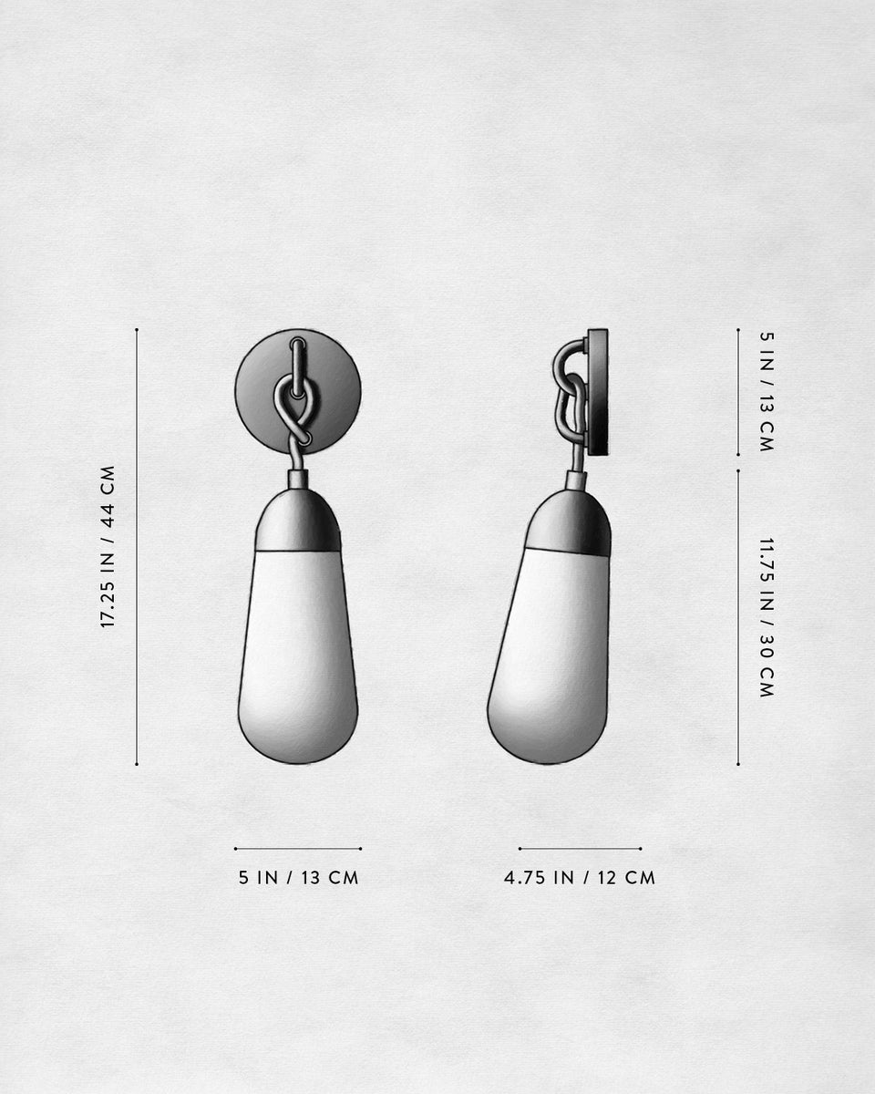 Technical illustration of two hanging weights with dimensions noted in inches and centimeters on a plain background.