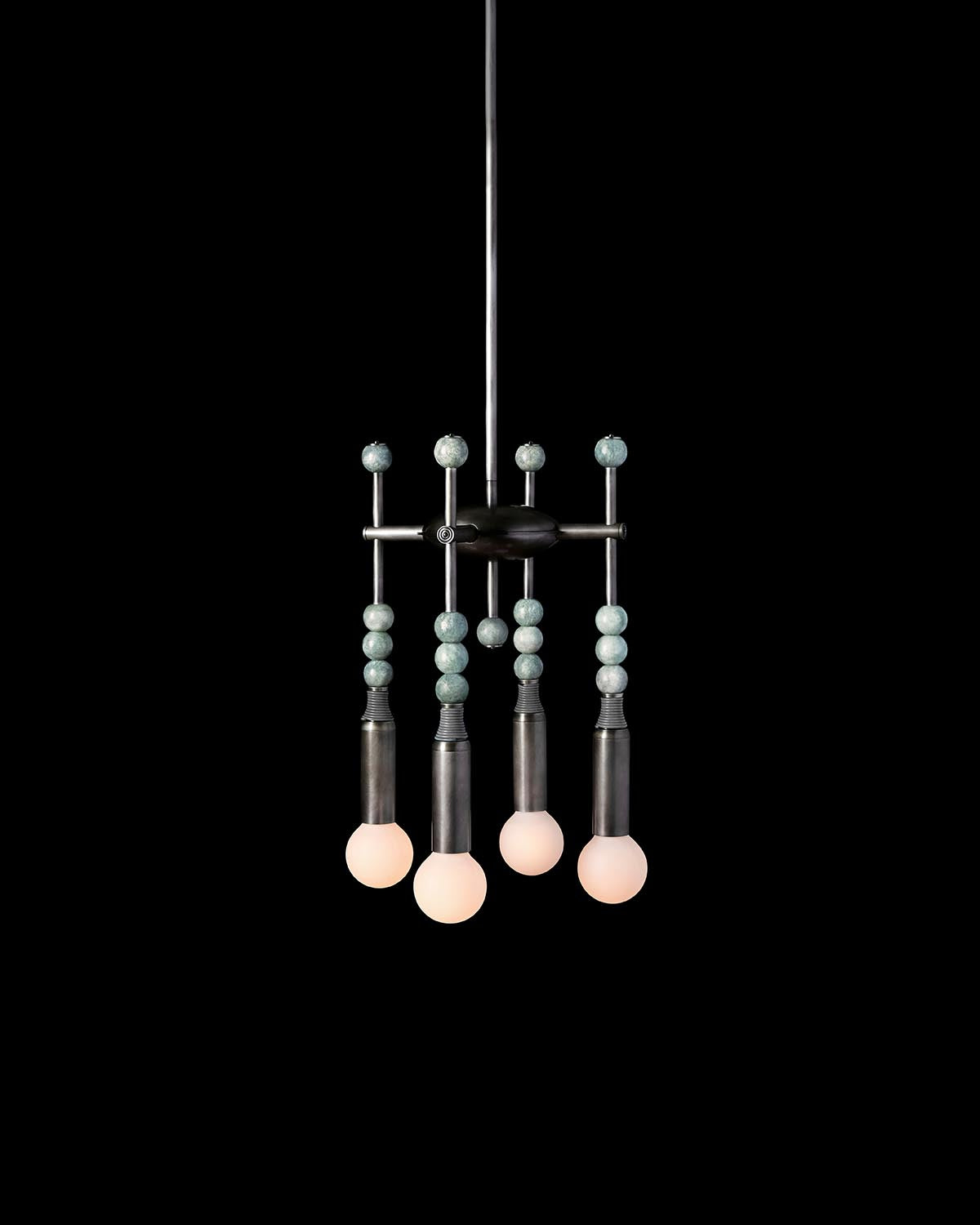 Suspended modern chandelier with four round bulbs and vertical rods adorned with turquoise beads on a black background