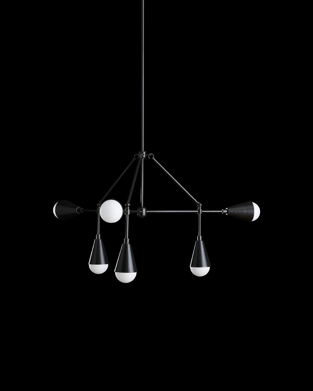 Modern black metal pendant light fixture with six spherical and conical white bulbs against a black background