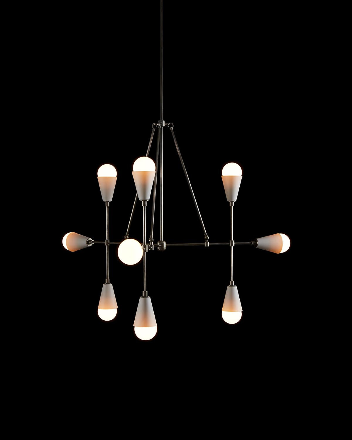 Minimalist modern pendant light fixture with nine illuminated bulbs and metal rods against a black background