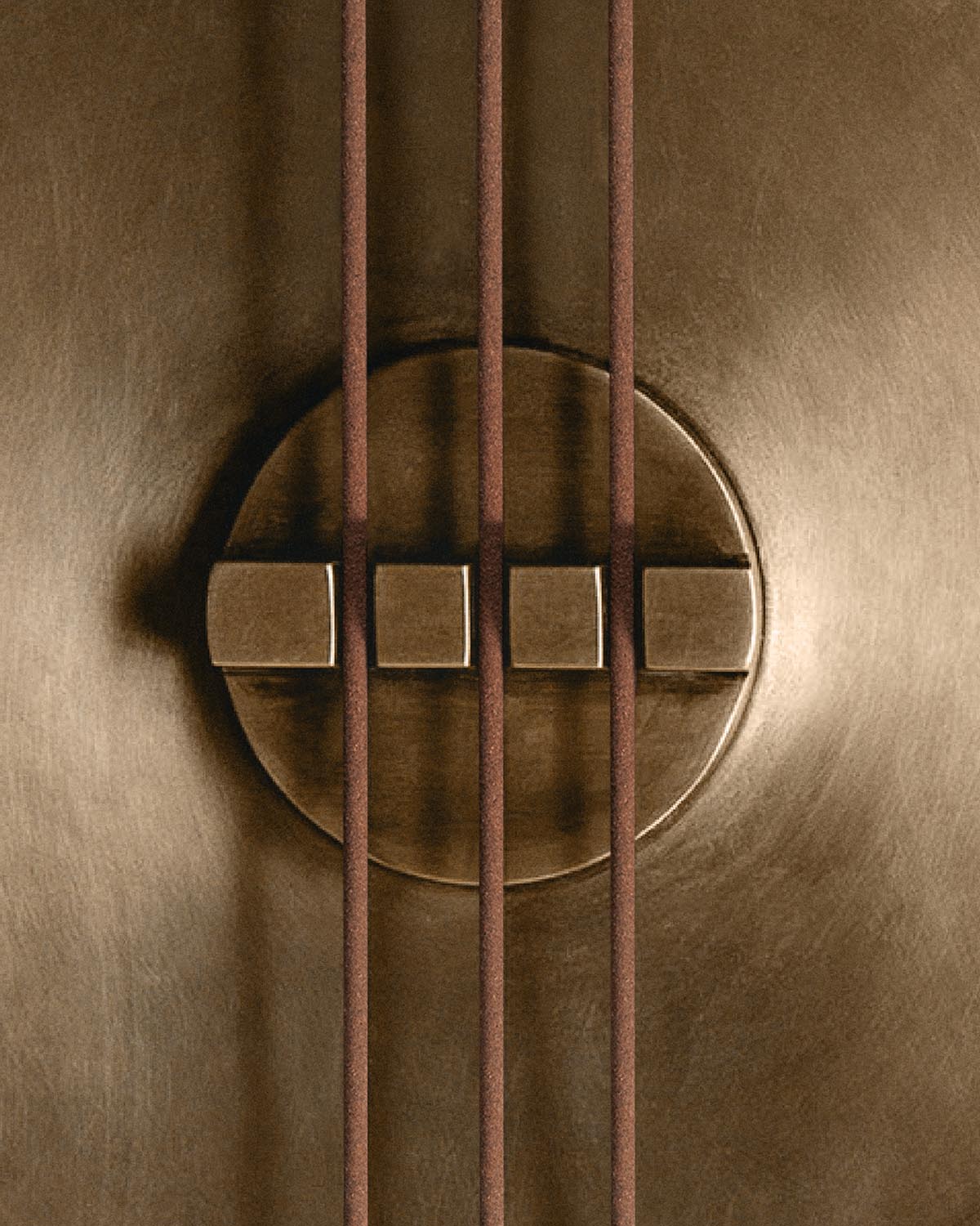 Close-up of a bronze circular censer with four square indentations and vertical rusty metal rods over its surface